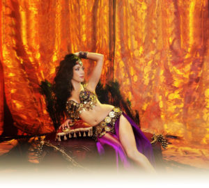 Sira NYC, lounges in a classic belly dancer pose